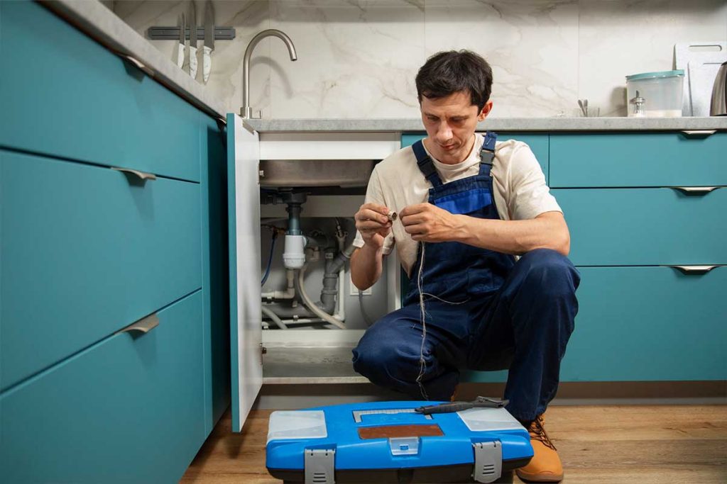 Boiler technician performing routine maintenance in Balham