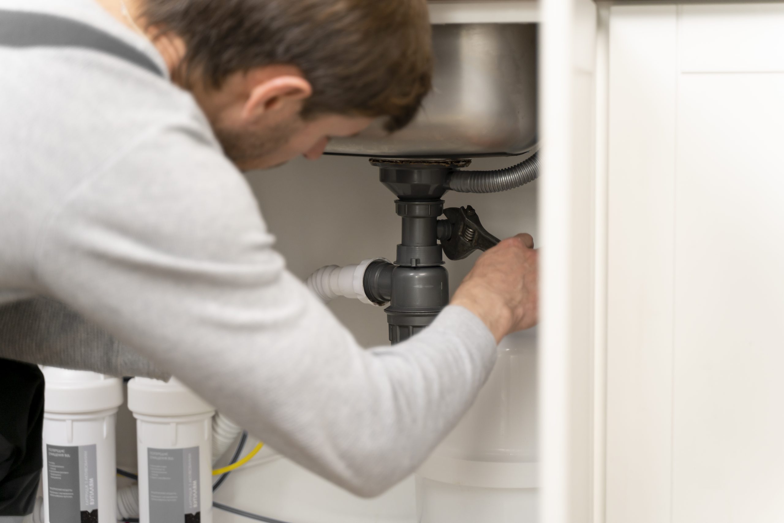 Technician installing a new boiler in a Clapham home